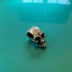 Silver skull charm